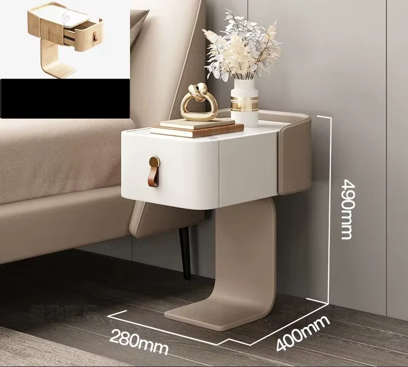 Modern nightstand with dimensions displayed next to a bed.