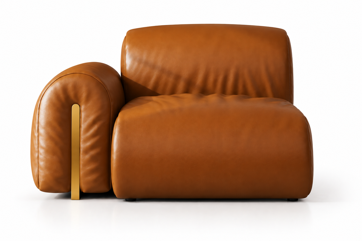 A modern low-profile armchair upholstered in smooth cognac brown leather, featuring a wide armrest with a vertical gold metal accent and a thick cushioned seat, shown against a plain white background.