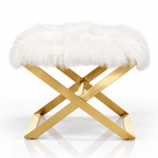 White faux fur ottoman with gold X-shaped metal frame on a white background