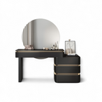 Black vanity table with round mirror and decorative items on a white background