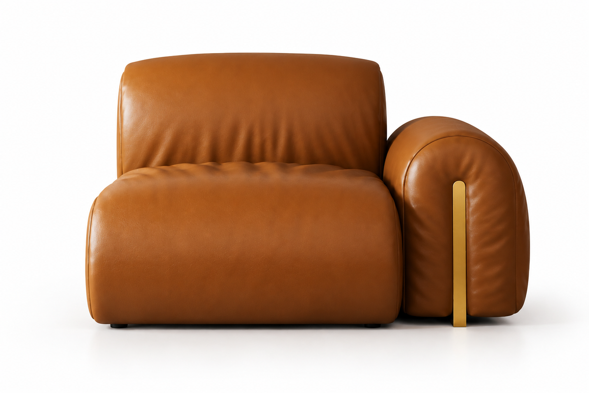 A modern low-profile leather armchair in a warm cognac brown, featuring a thick rectangular seat, a rounded backrest, and a matching rounded right armrest with a slim vertical gold metal accent leg, shown on a white background.
