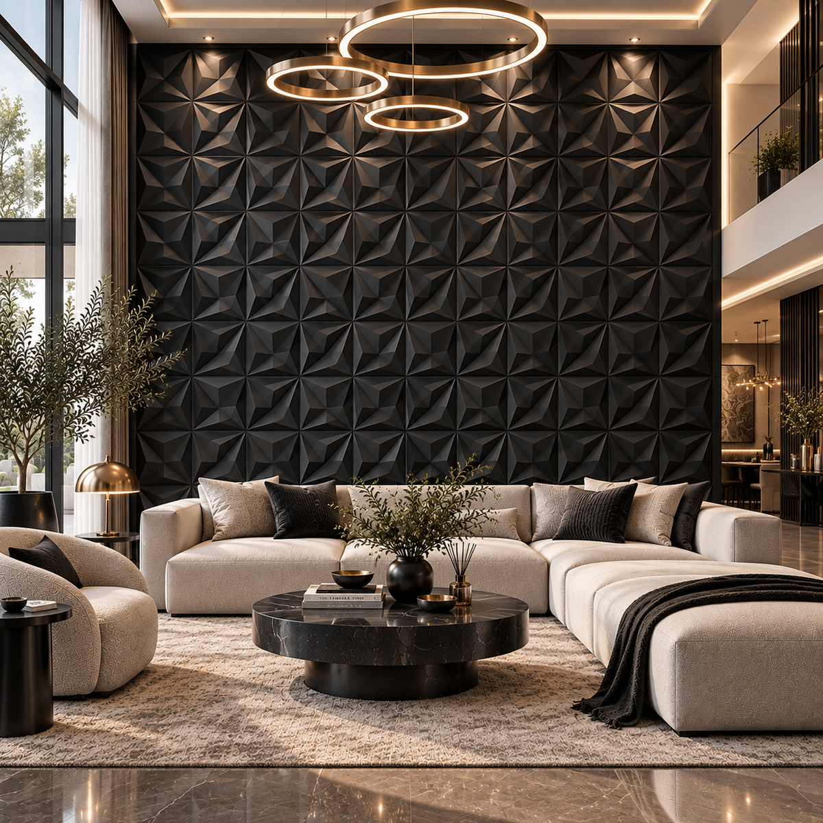 A modern living room featuring a large beige sectional sofa with dark accent pillows, a round black marble coffee table, a textured black geometric accent wall, and three hanging circular ring lights.