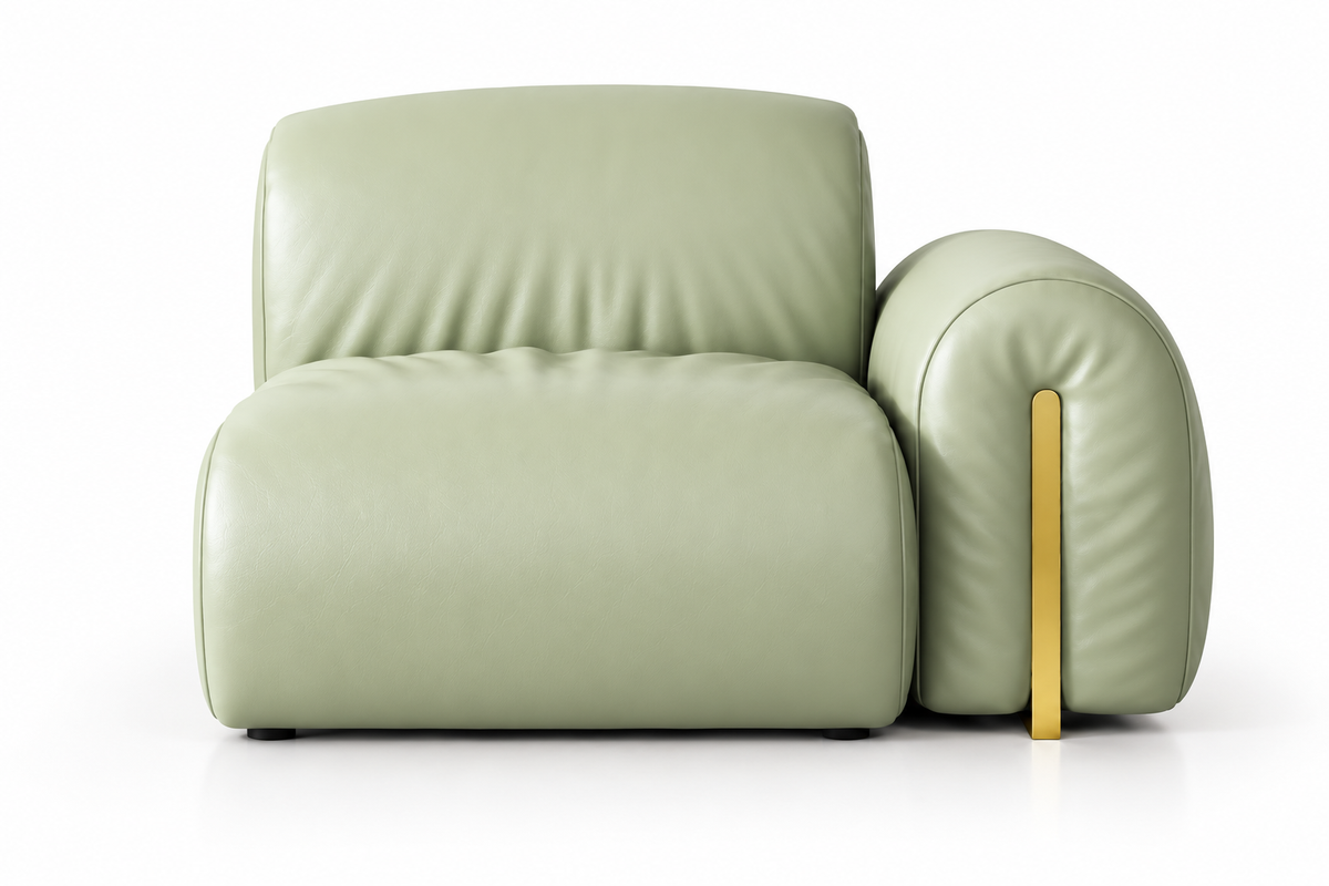 A modern, low-profile armchair upholstered in light sage green leather, featuring a wide backrest, a rounded armrest, and a contrasting vertical gold metal leg, shown against a plain white background.