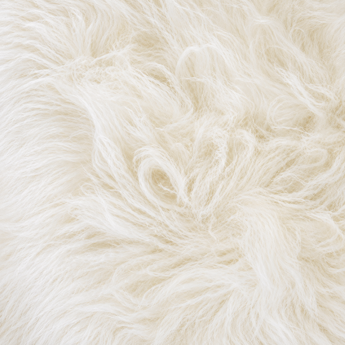 Close-up of fluffy faux fur fabric in a warm off-white or cream color, showing the soft texture and individual fibers.