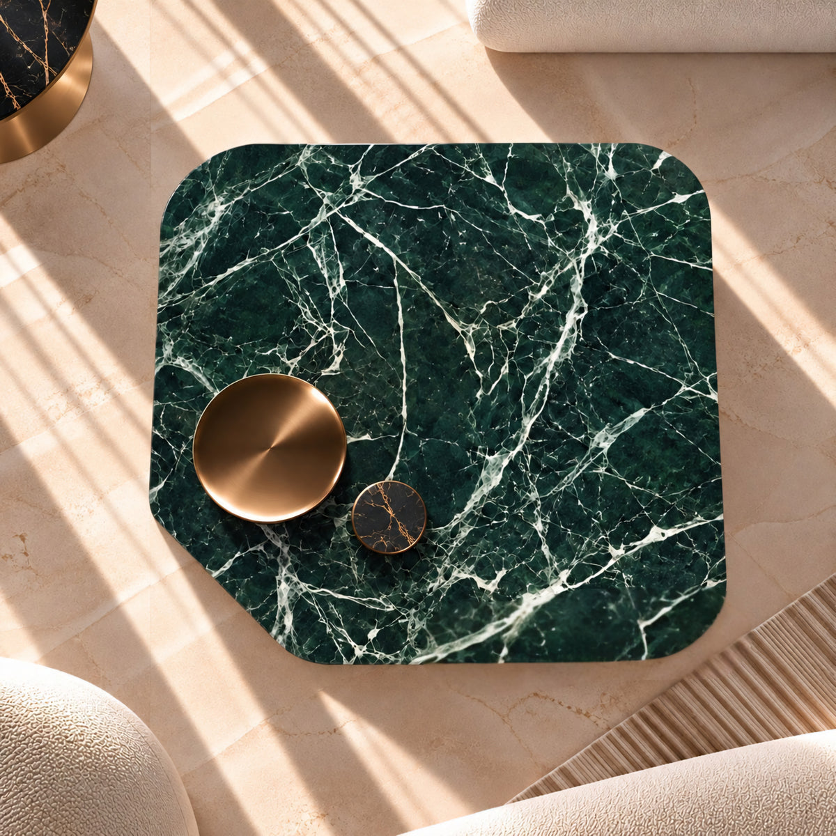 A square green marble-patterned tray or coaster with rounded corners, styled on a beige textured surface with two metallic gold and black coasters on top.