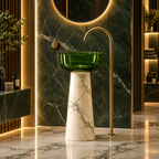 A modern pedestal sink with a green glass bowl and a white marble base, set against a dark green marble wall with a gold faucet in a luxurious bathroom.
