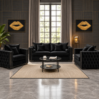 A luxury living room set featuring a black tufted sofa, two matching armchairs, a black glass coffee table, and a beige rug, set against dark wood paneled walls with gold accents and framed gold lip art.