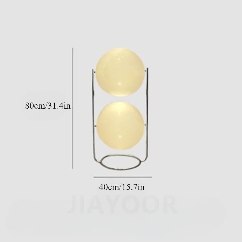 Decorative lamp with two spherical shades on a light gray background