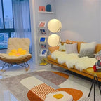 Modern living room with yellow sofa, armchair, and decorative items.