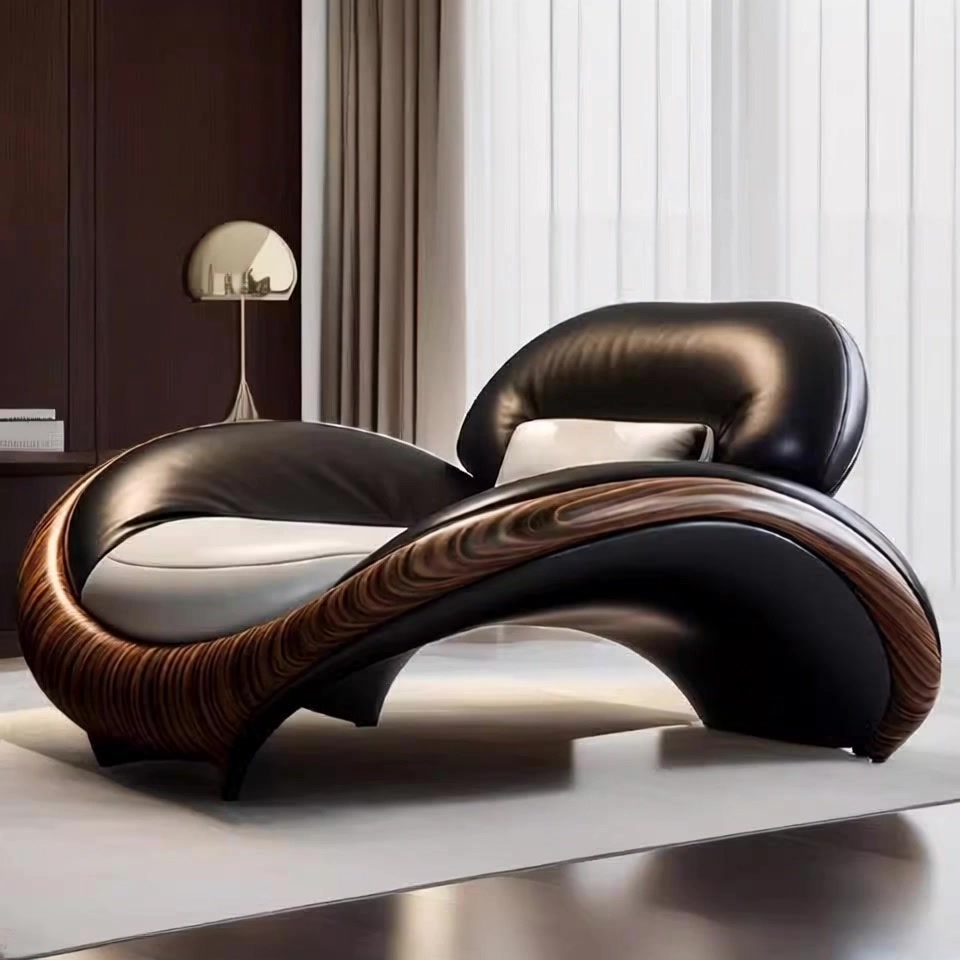 Modern, curved leather chair in a room with curtains and a lamp.