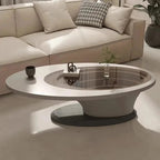 An oval-shaped luxury coffee table made of wood-based panels with a minimalist design, placed in a living room setting.