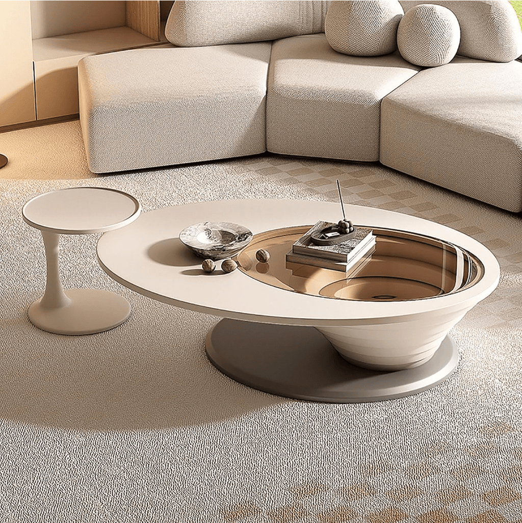 An oval-shaped luxury coffee table made of wood-based panels with a minimalist design, placed in a living room setting.