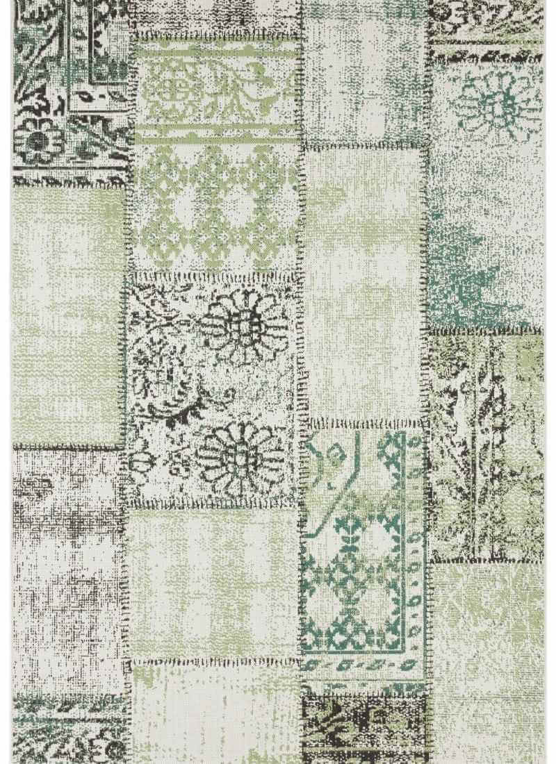 Patterned rug with a mix of green, gray, and white colors