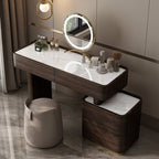 Dressing table with mirror and various items in a modern bathroom setting