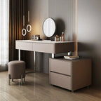 Modern vanity table with mirror and stool in a stylish room.