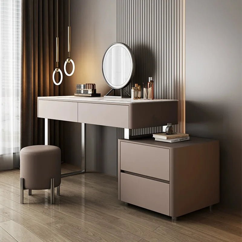 Modern vanity table with mirror and stool in a stylish room.