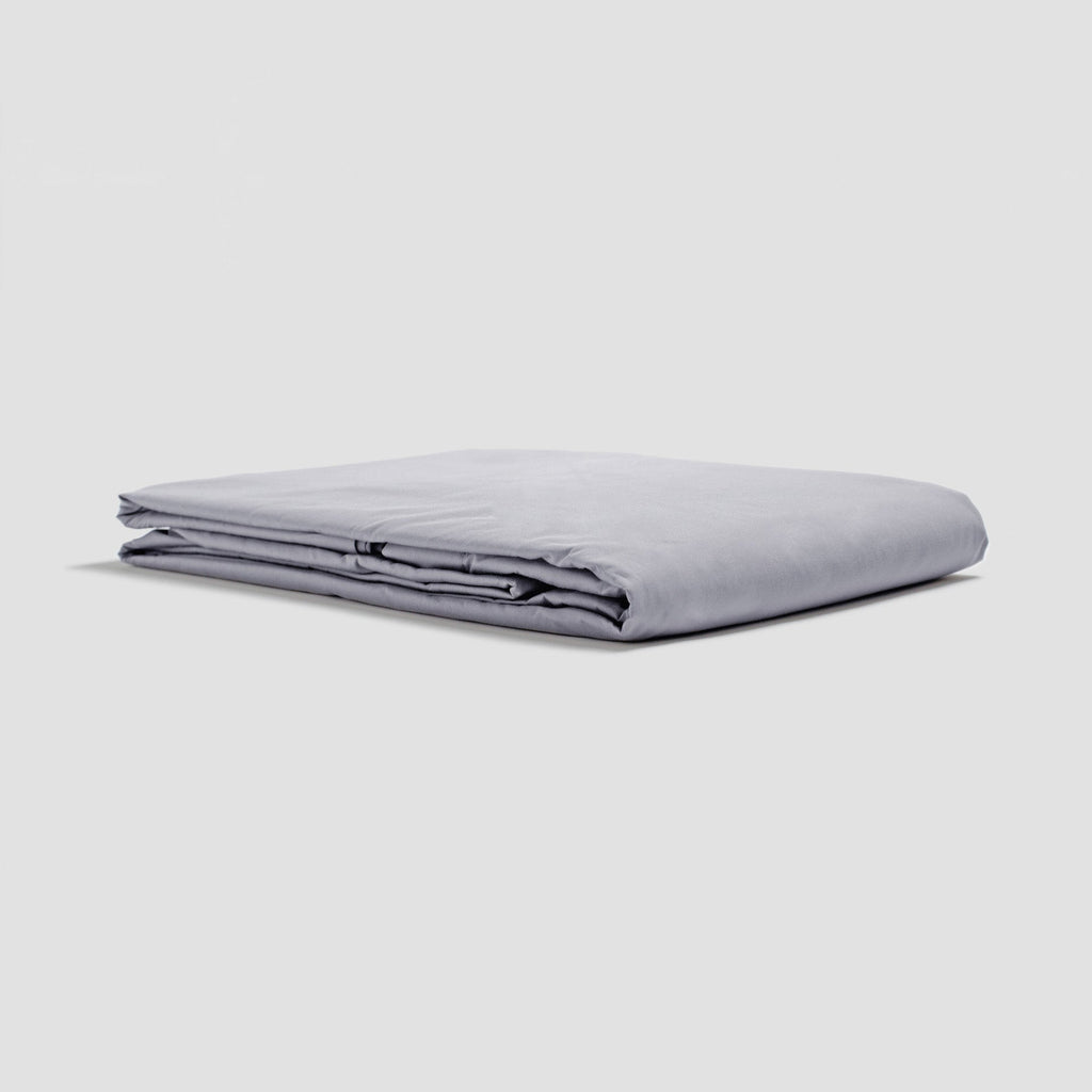 Folded light gray sheet on a white background
