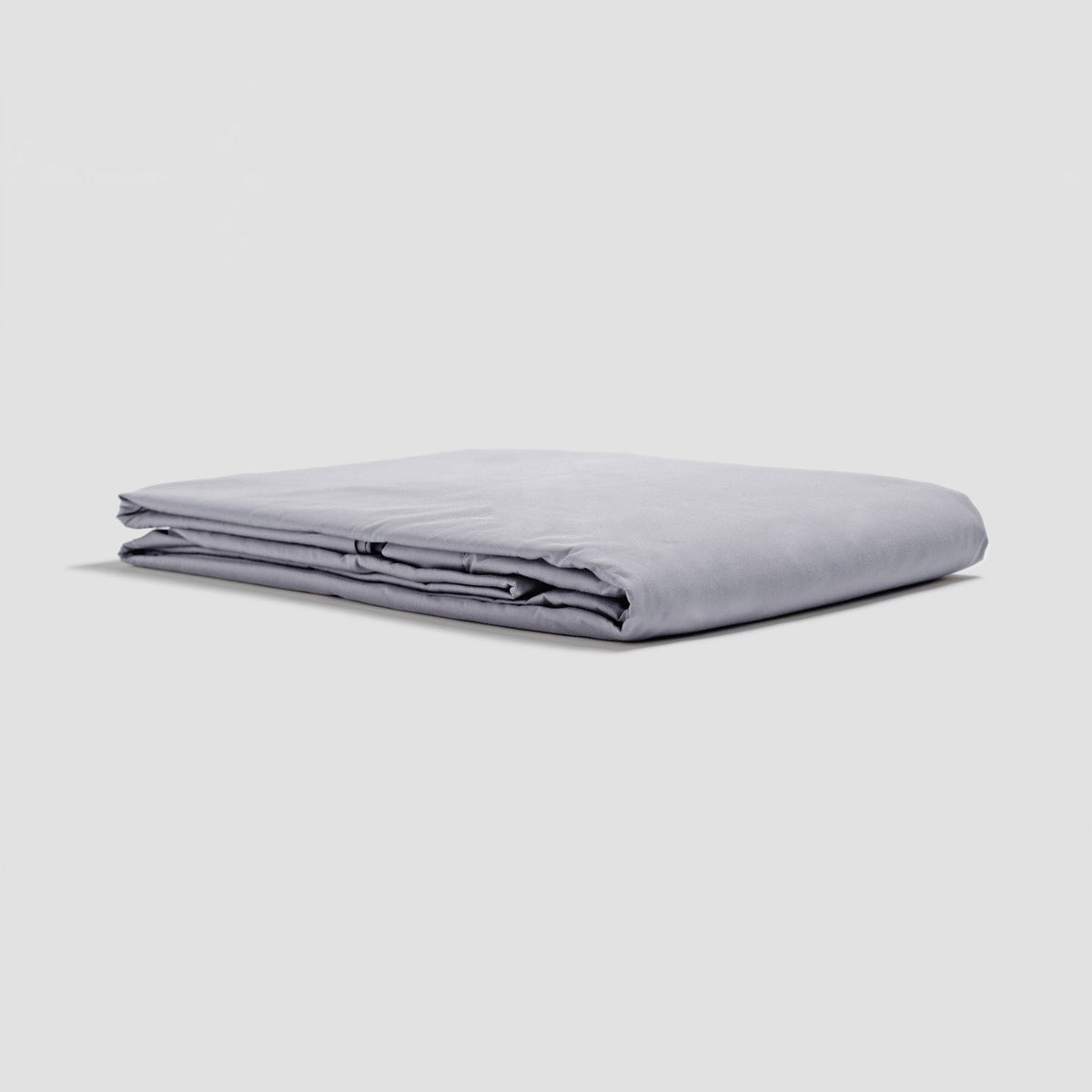 Folded light gray sheet on a white background