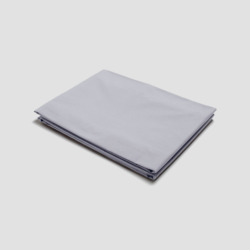 Folded light gray fabric on a white background
