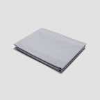 Folded light gray fabric on a white background