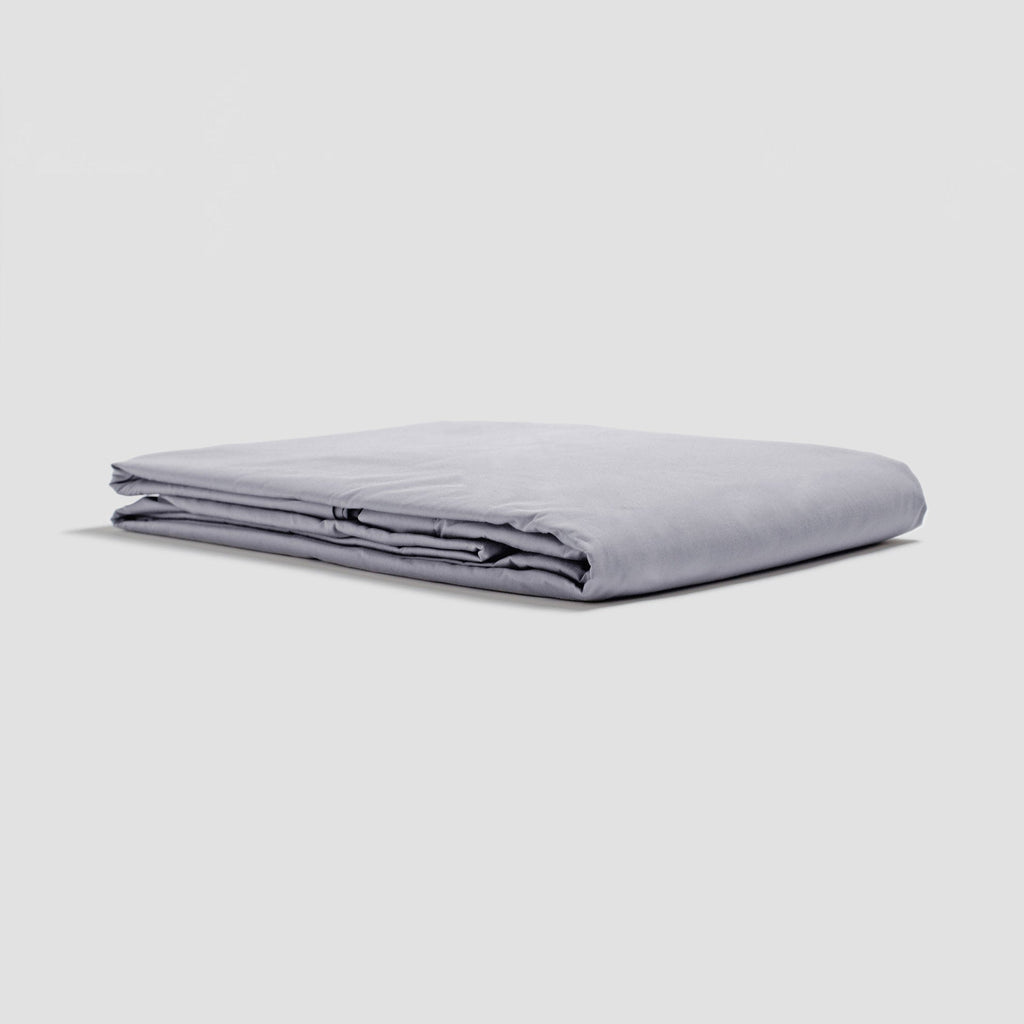 Folded light gray sheet on a white background