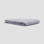 Folded light gray sheet on a white background