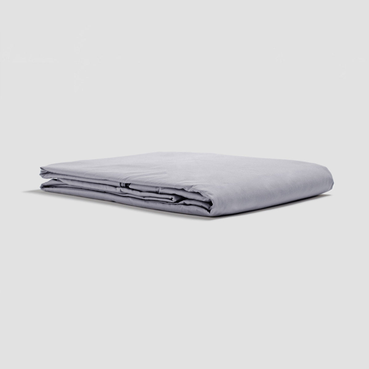 Folded light gray sheet on a white background