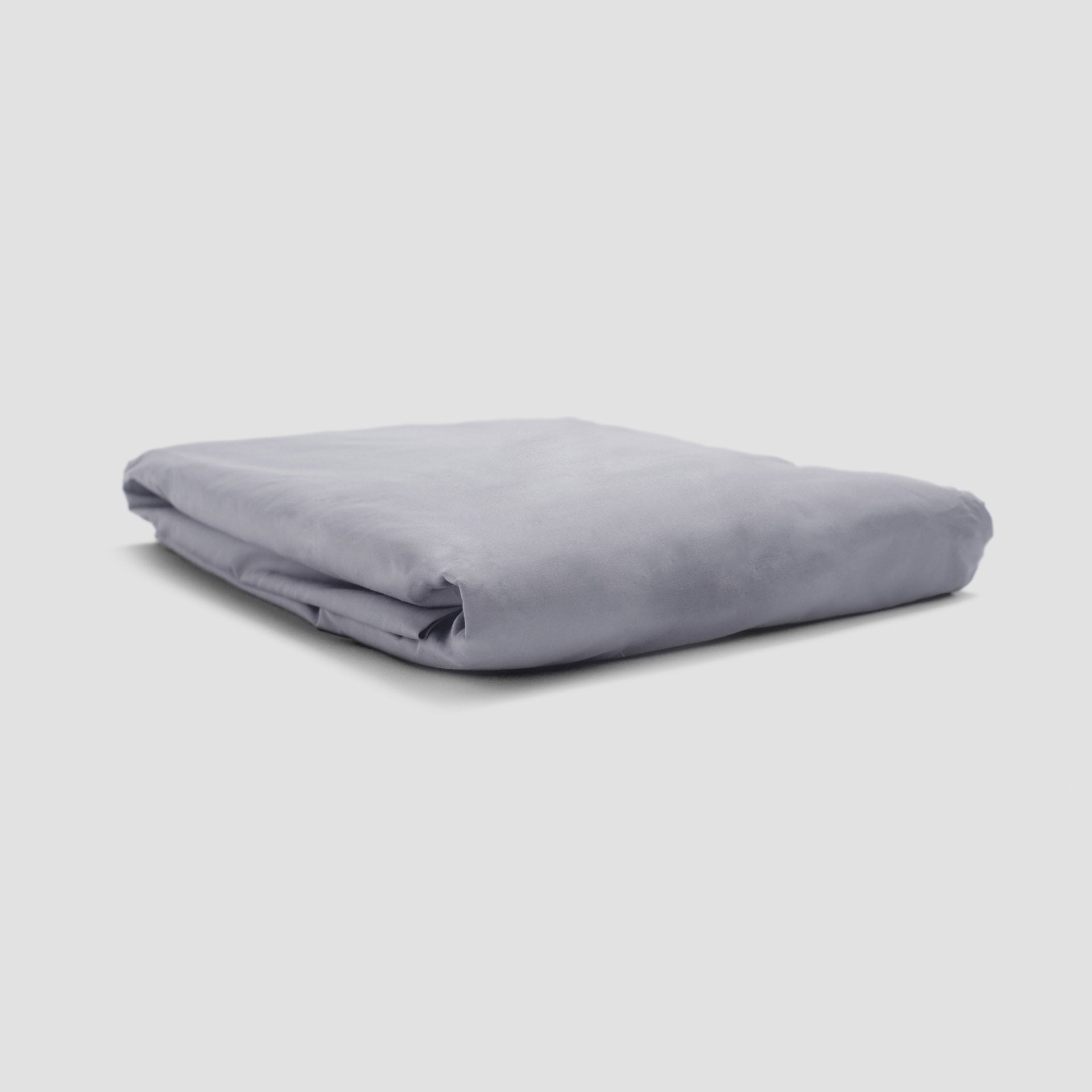 Folded gray fabric on a light gray background