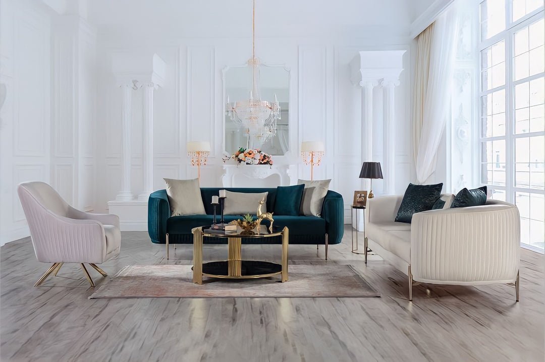 Modern living room with a teal sofa, beige armchairs, and a coffee table.