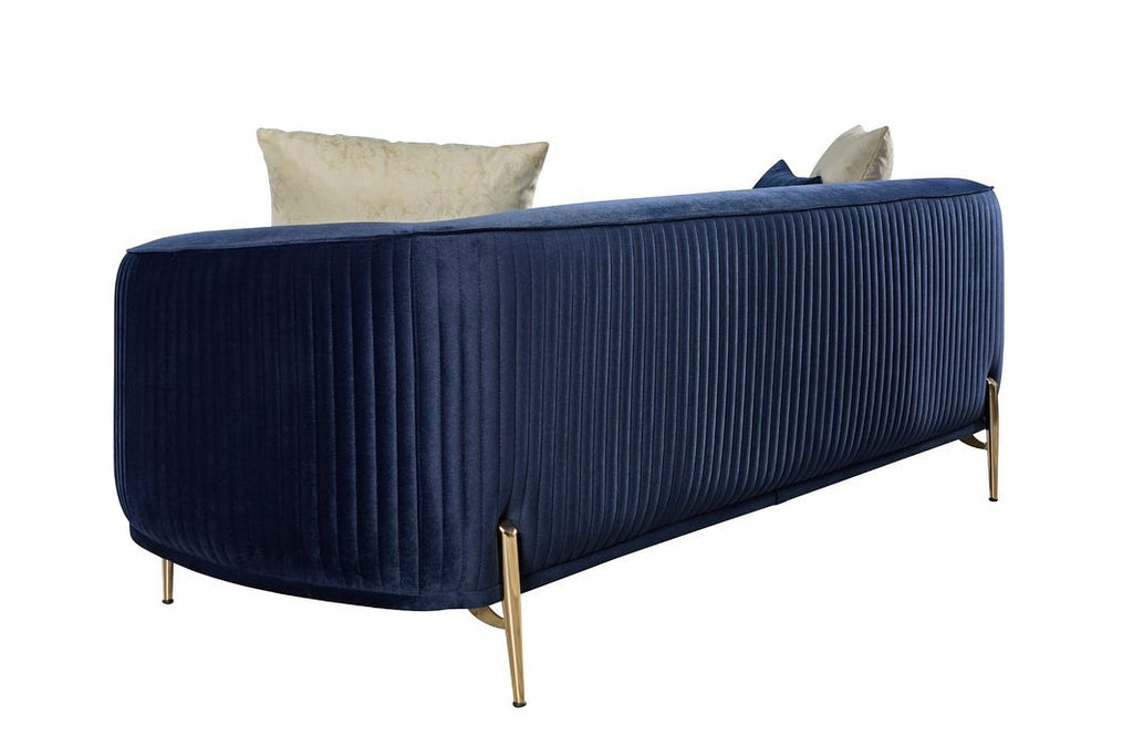 Navy blue sofa with gold legs on a white background