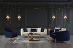 Modern living room with navy blue and white furniture against a dark paneled wall.