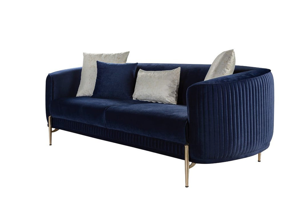 Navy blue velvet sofa with gold legs on a white background