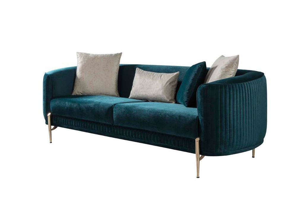 Teal sofa with beige cushions on a white background