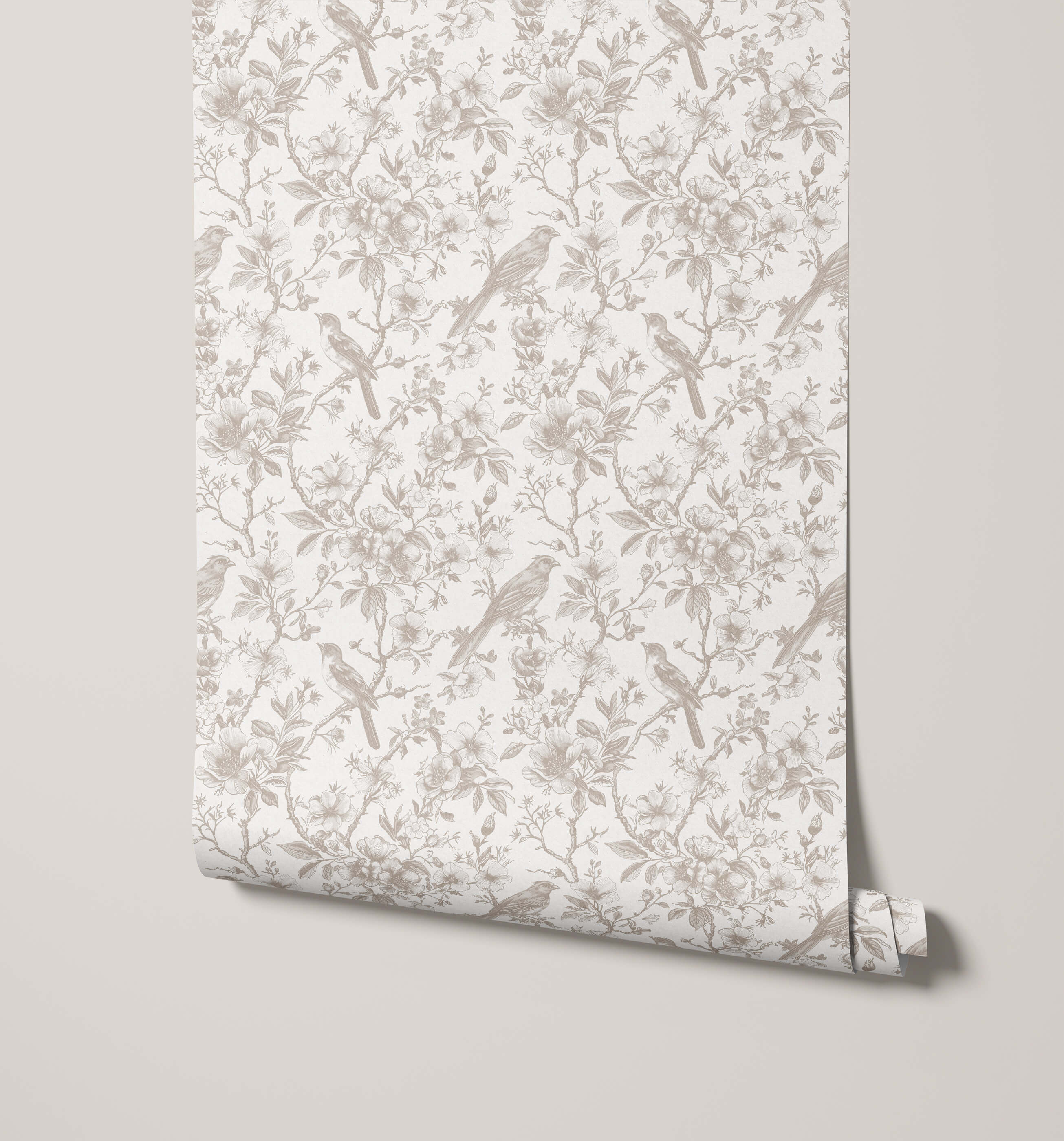 Roll of wallpaper with bird and floral pattern on a plain background