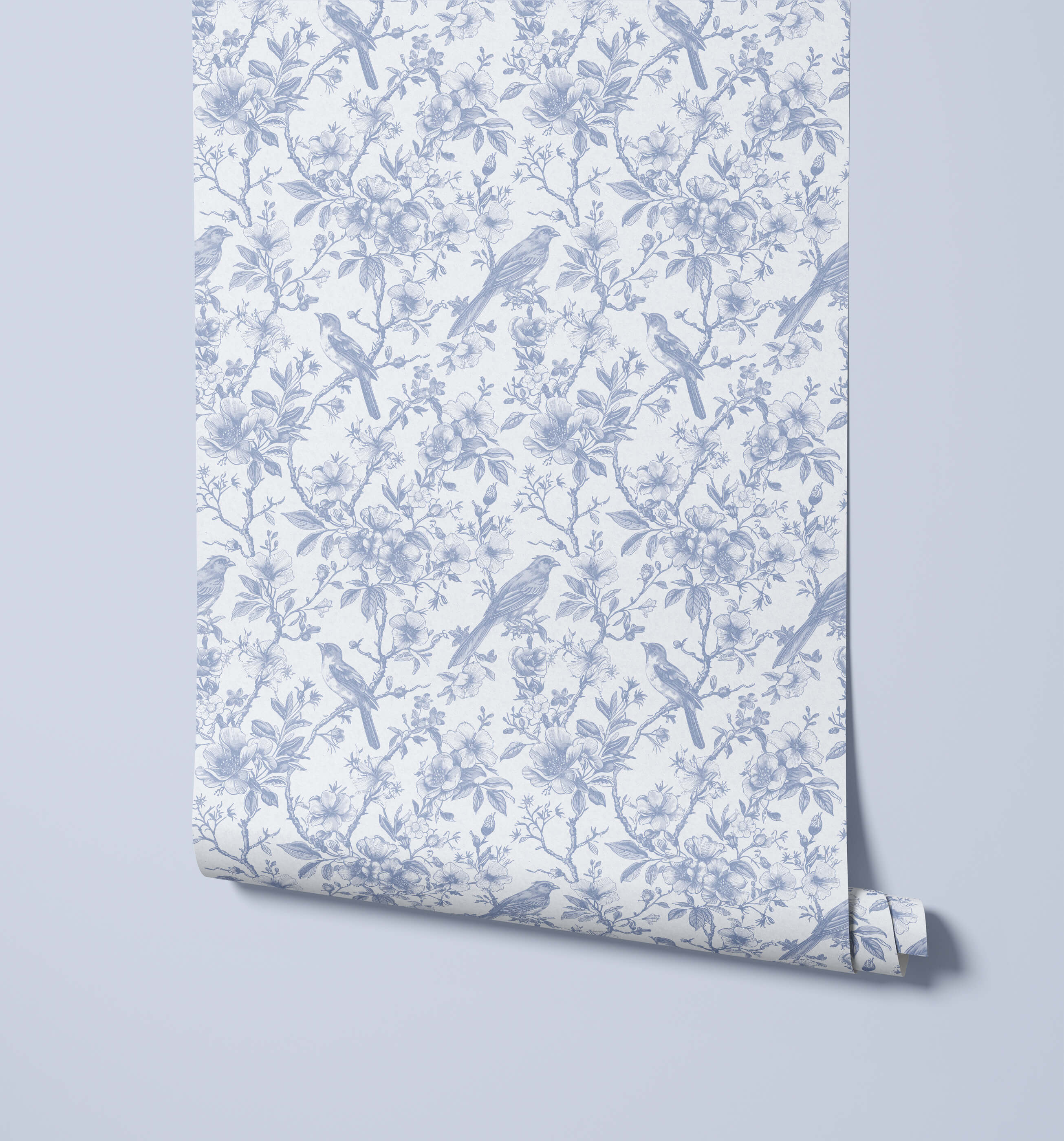Roll of wallpaper with blue bird and floral pattern on a light gray background