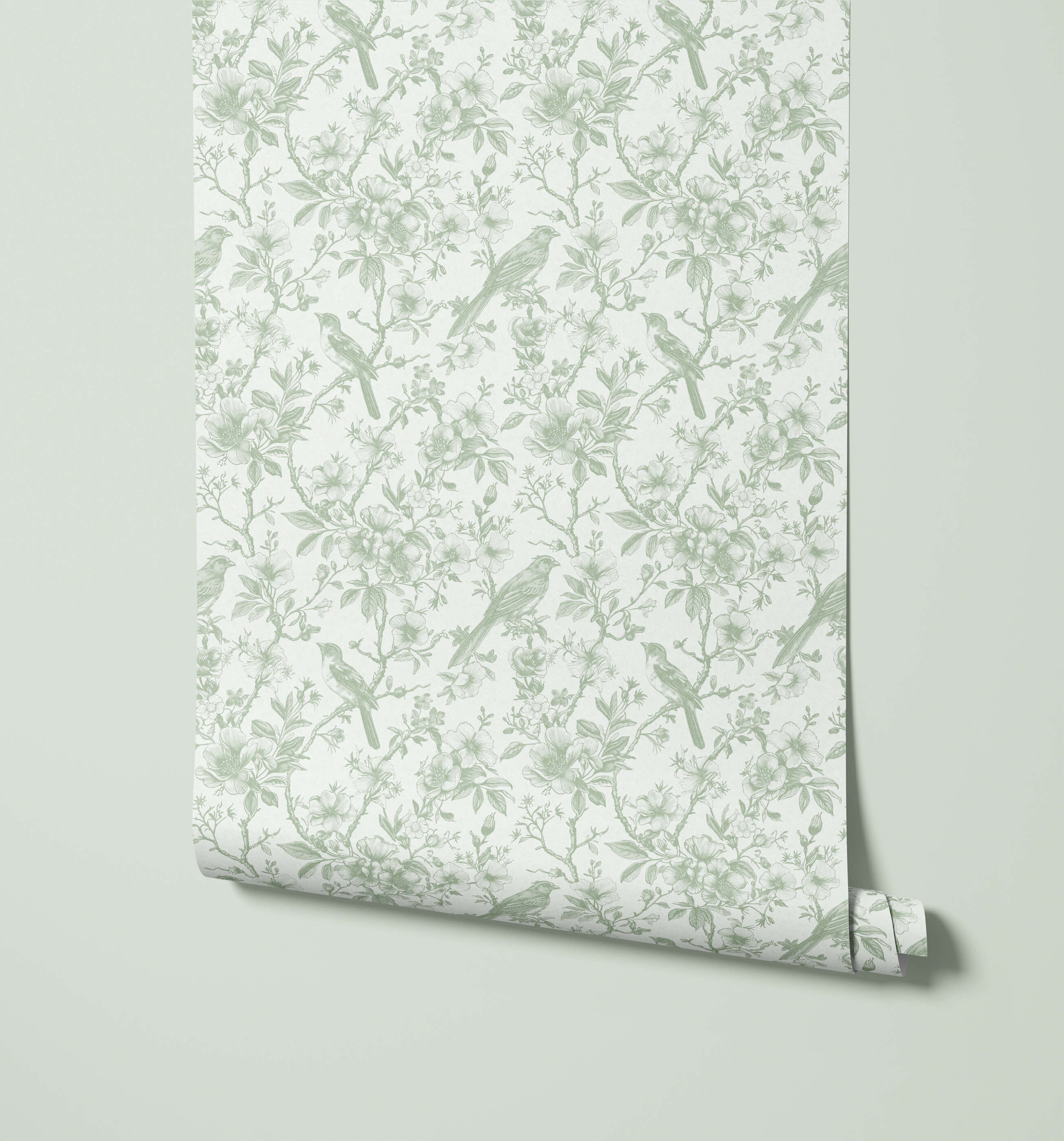 Roll of wallpaper with bird and branch pattern on a light gray background