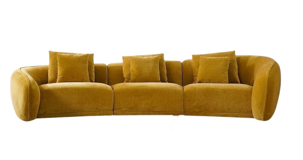 Mustard yellow sofa with plush cushions on a white background