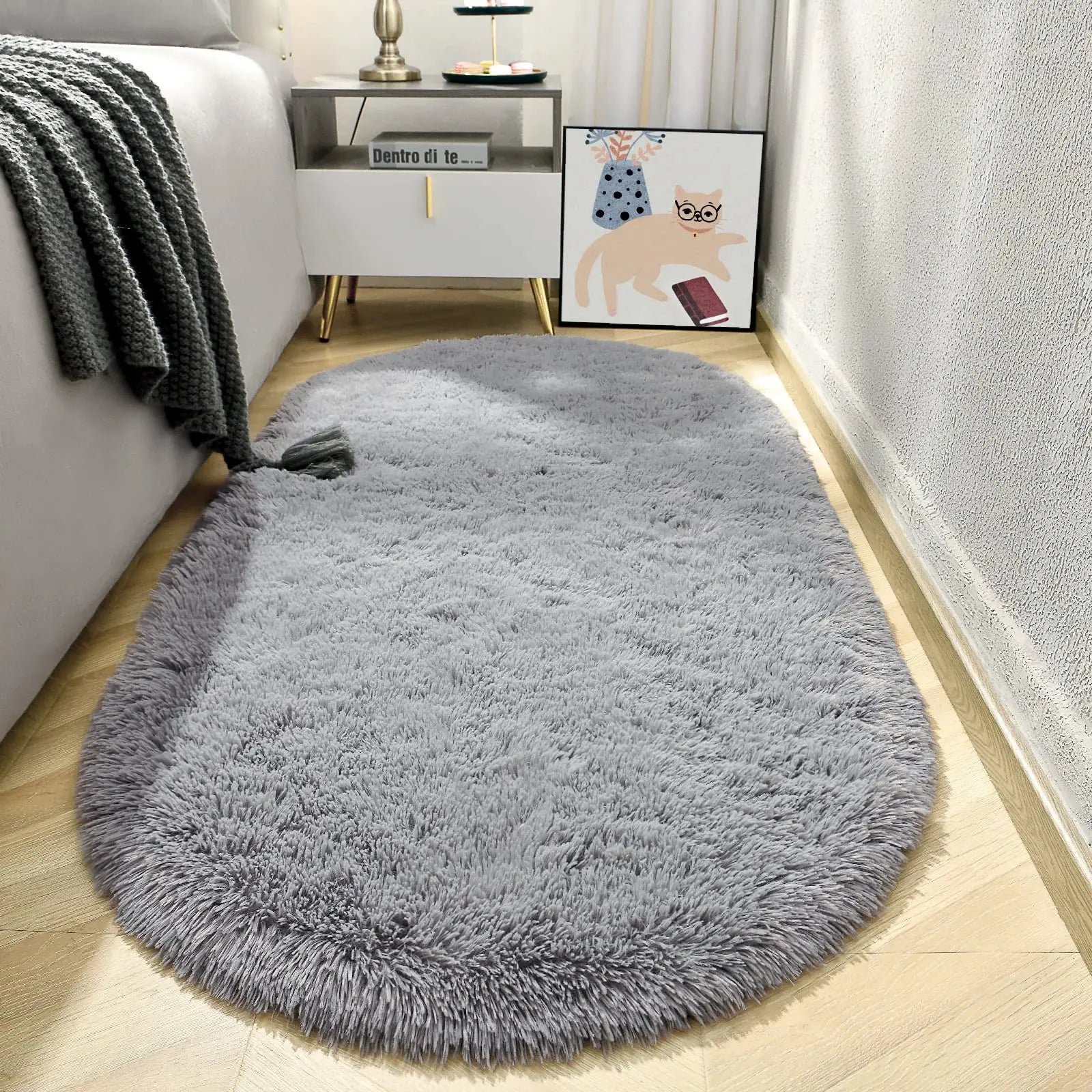 Gray shaggy rug on a wooden floor in a living room setting.