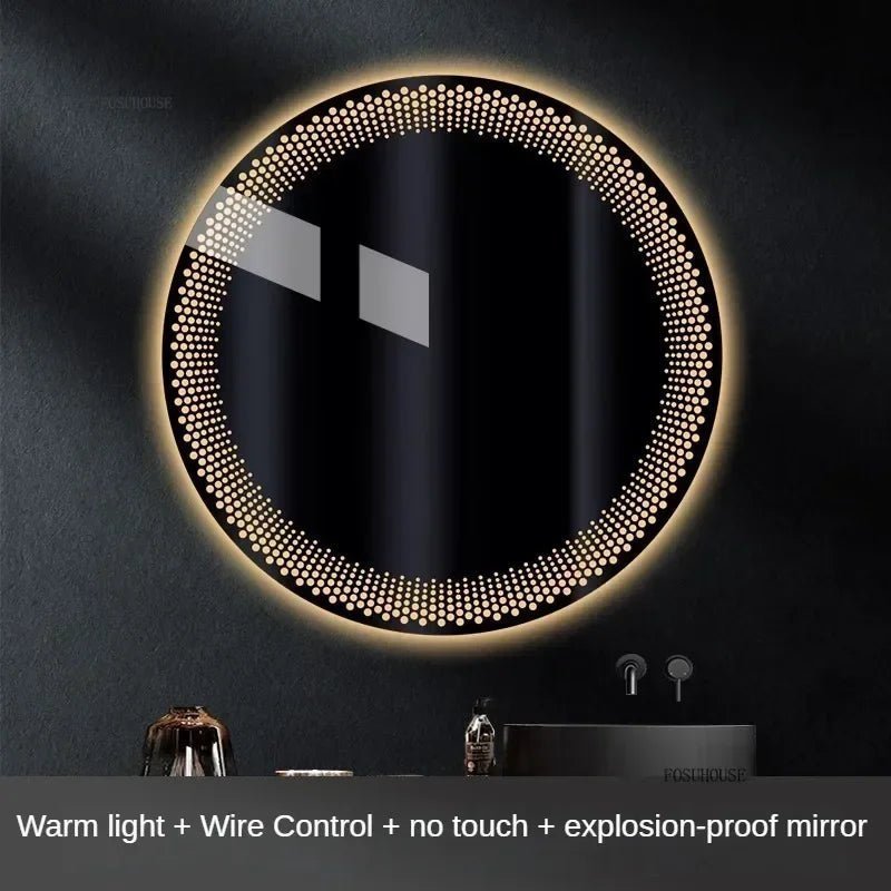 Round LED mirror with warm light and wire control on a dark wall.