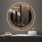 A round LED bathroom mirror with a silver aluminum frame, featuring a digital display at the bottom and illuminated with multicolored lights, mounted on a wall above a white sink.