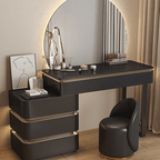 Modern black vanity table with mirror and stool in a room setting