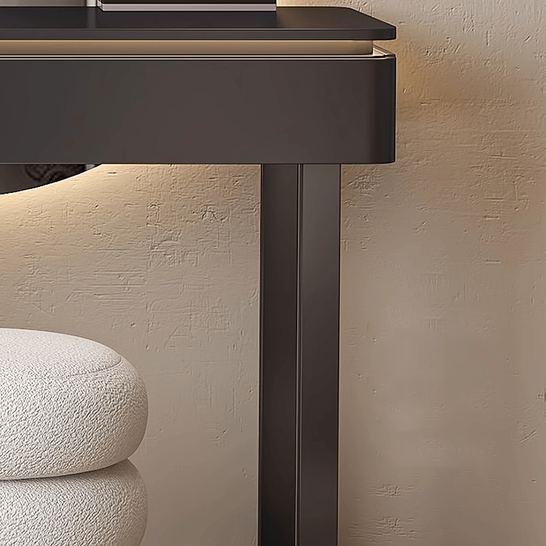 Dark brown rectangular table with a textured surface against a beige wall.
