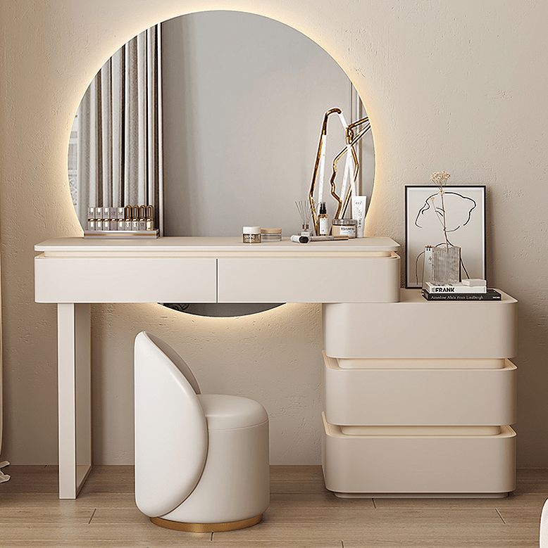 Modern white vanity with round mirror and chair in a room.