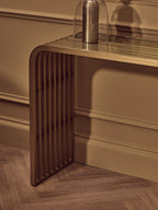 Matte Gold Slatted Console Table with Clear Glass Top | Vogue - MOOAZAA