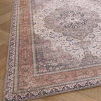 Decorative rug with intricate patterns on a wooden floor