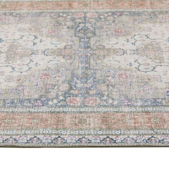Patterned rug with a mix of colors on a white background