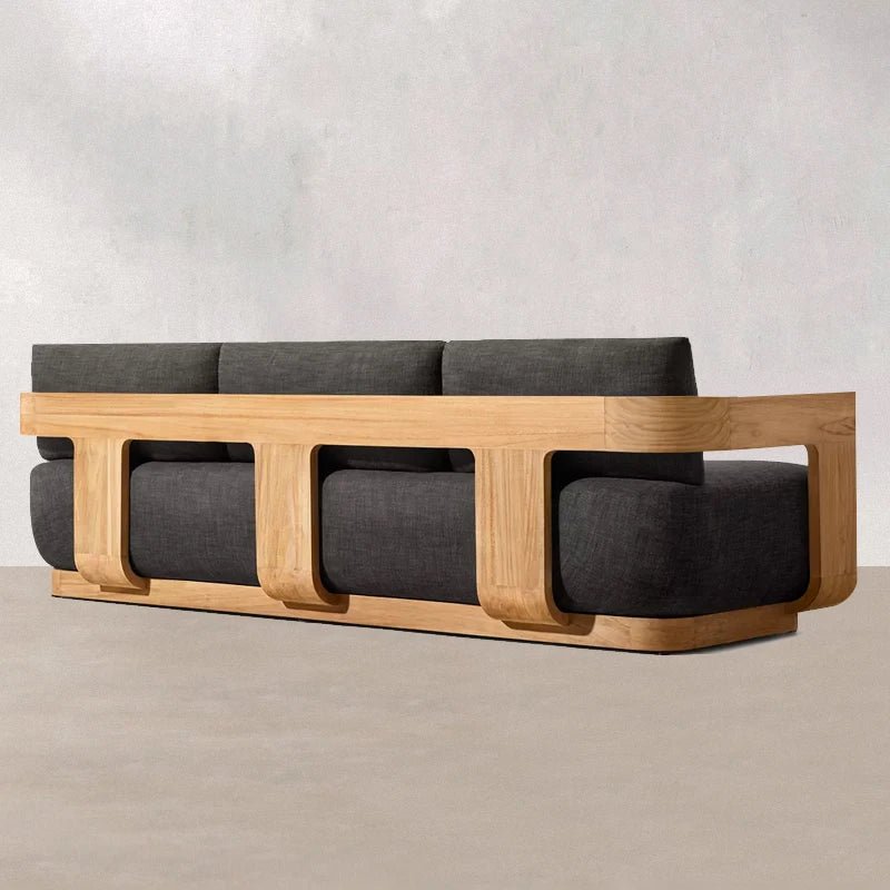 Sofa with wooden frame and gray cushions on a neutral background