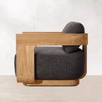 Modern chair with wooden frame and gray cushion on a white background