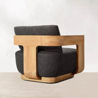 Modern chair with wooden frame and gray cushion on a white background