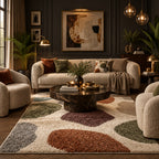 Living room with a patterned rug, sofa, and decorative items.